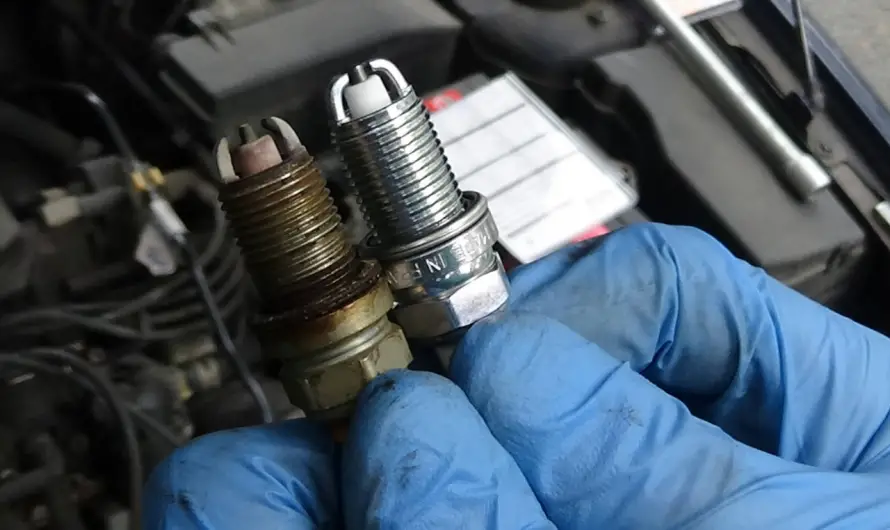 What to do with a motorcycle spark plug that smells of gasoline?